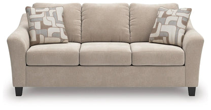 Willarae sofa, beige fabric sofa with two geometric-patterned pillows by Unique Piece Furniture on Tampa Home & Garden Store