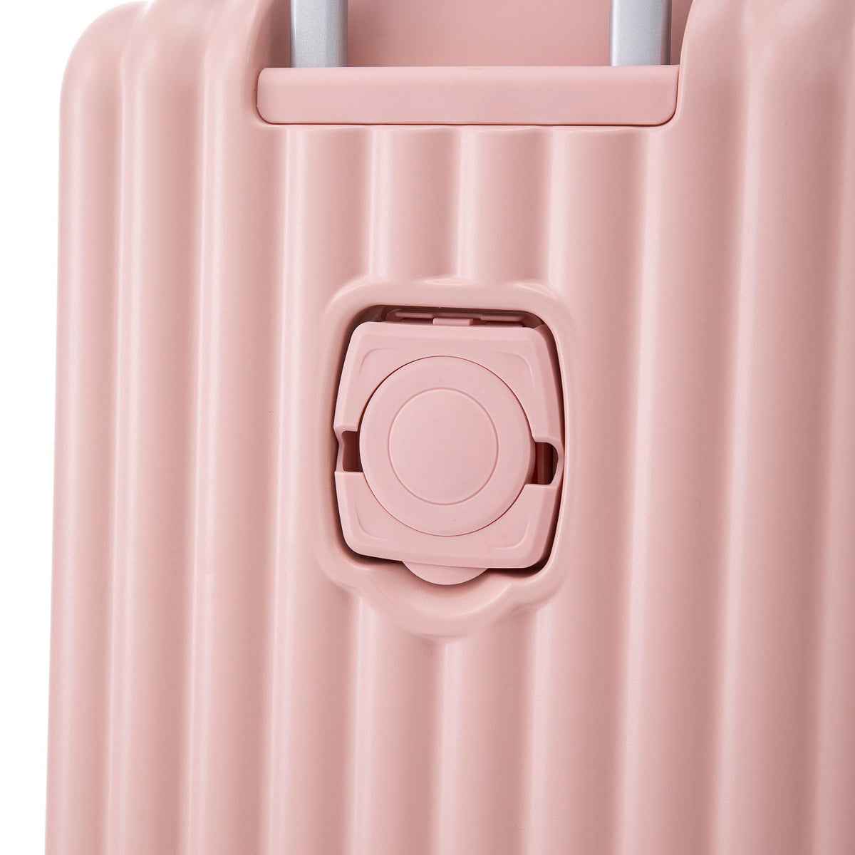 Pink hard-shell spinner luggage close-up showing latch and wheel housing on Tampa Home & Garden Store