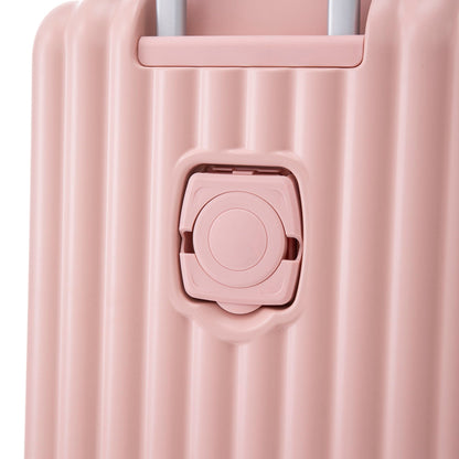 Pink hard-shell spinner luggage close-up showing latch and wheel housing on Tampa Home & Garden Store