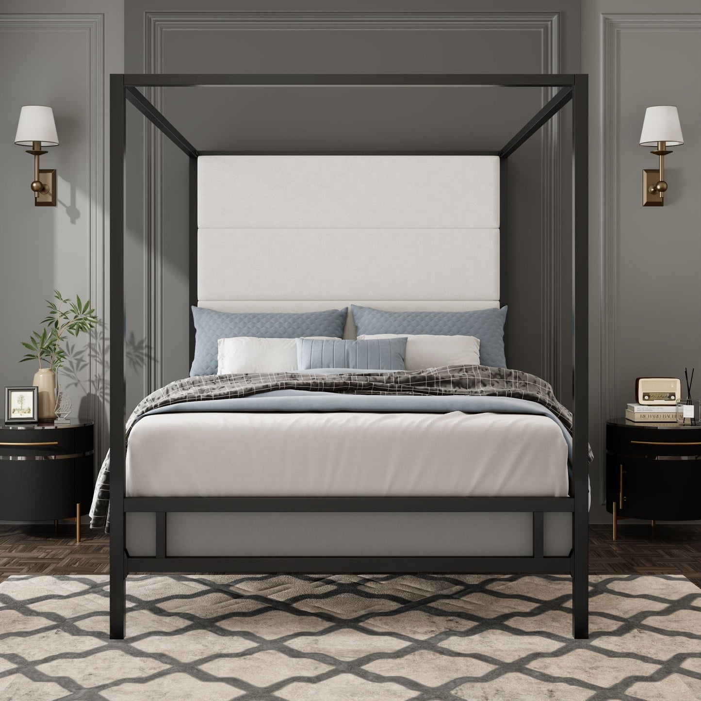 Canopy bed with tall beige upholstered headboard and four-poster frame in dark metal, blue-gray pillows on Tampa Home & Garden Store
