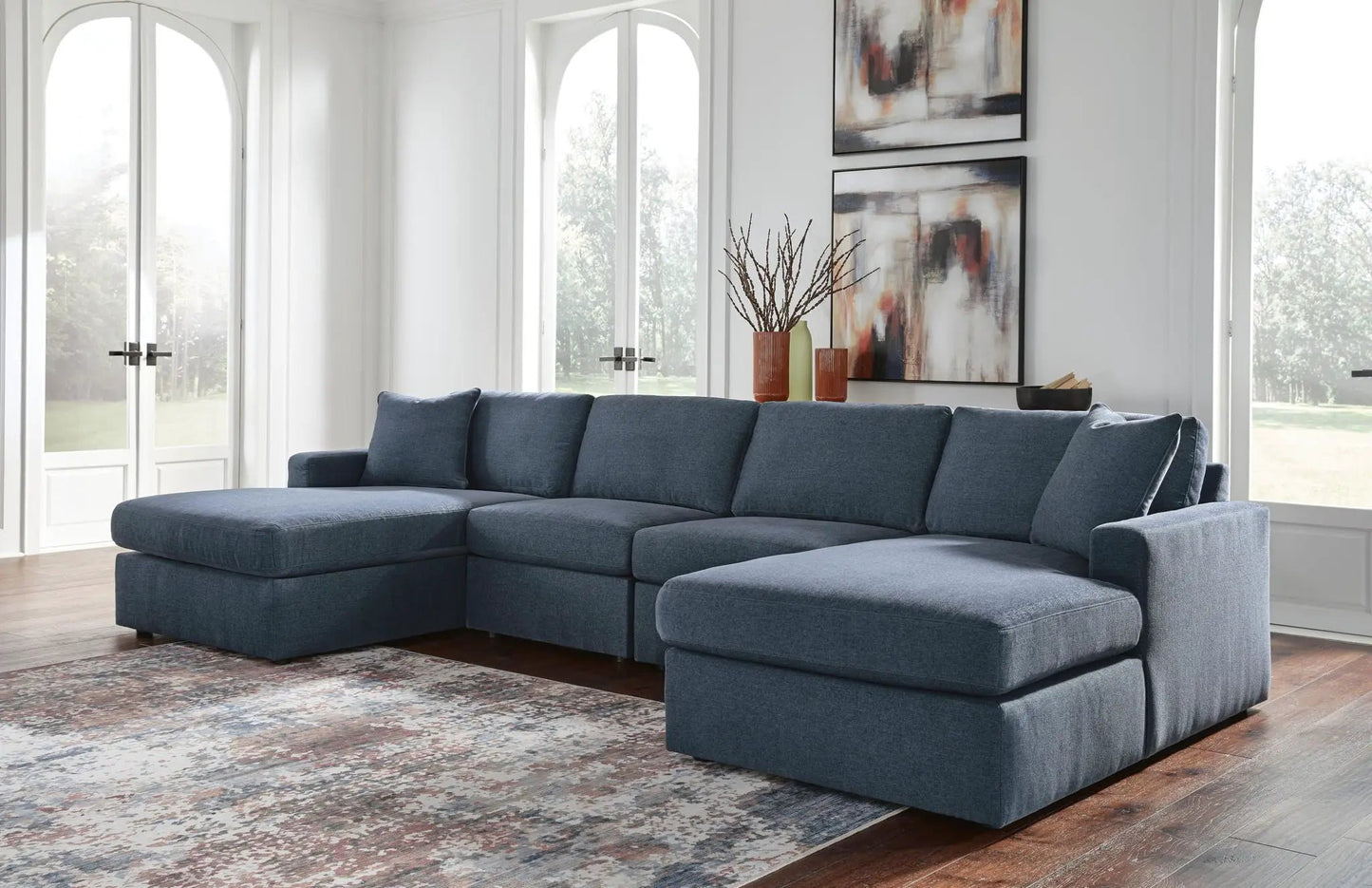 Modmax Sectional Ink blue fabric sofa, large stationary L-shaped unit in a bright living room on Tampa Home & Garden Store
