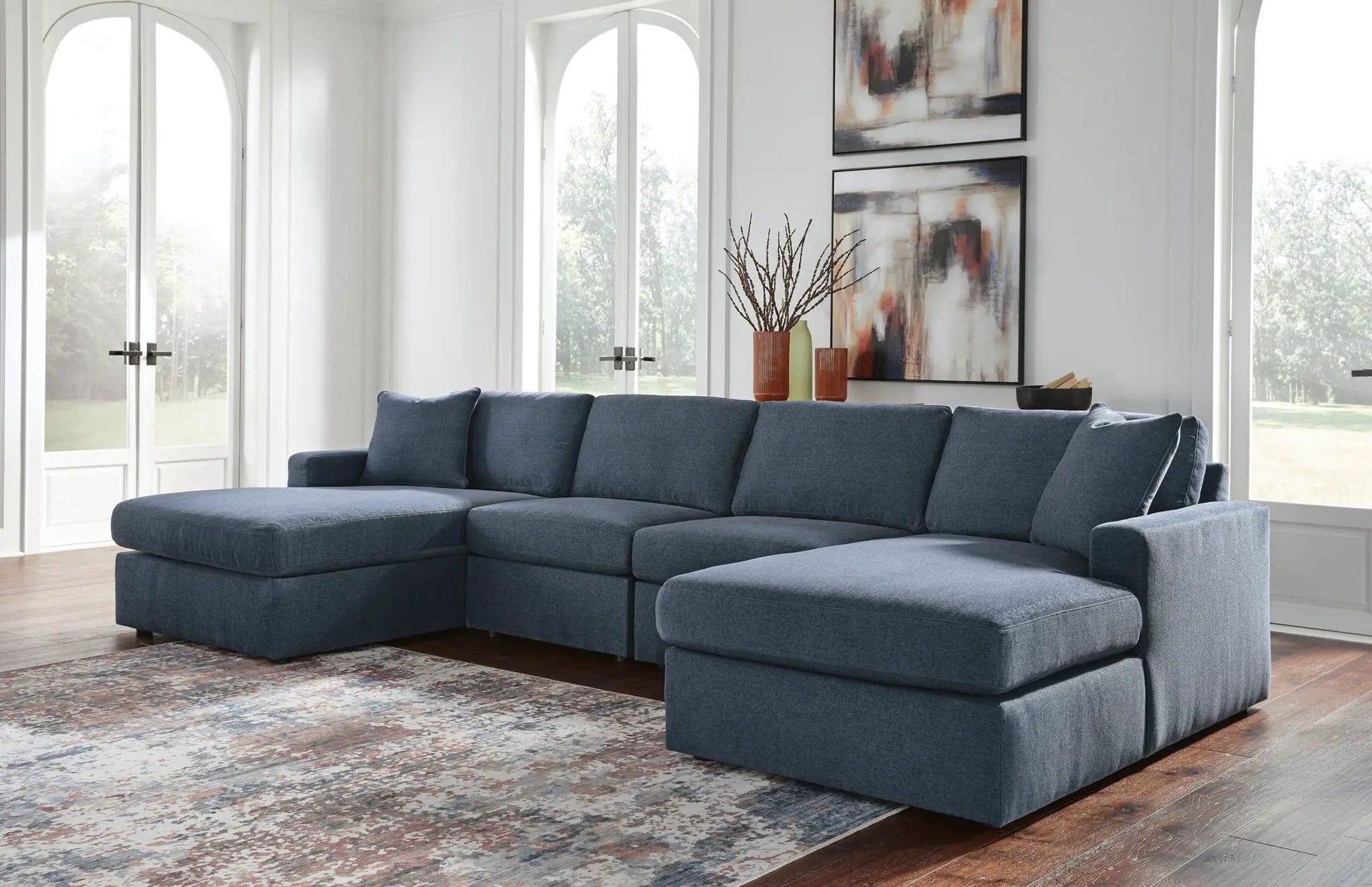 Modmax Sectional Ink blue fabric sofa, large stationary L-shaped unit in a bright living room on Tampa Home & Garden Store