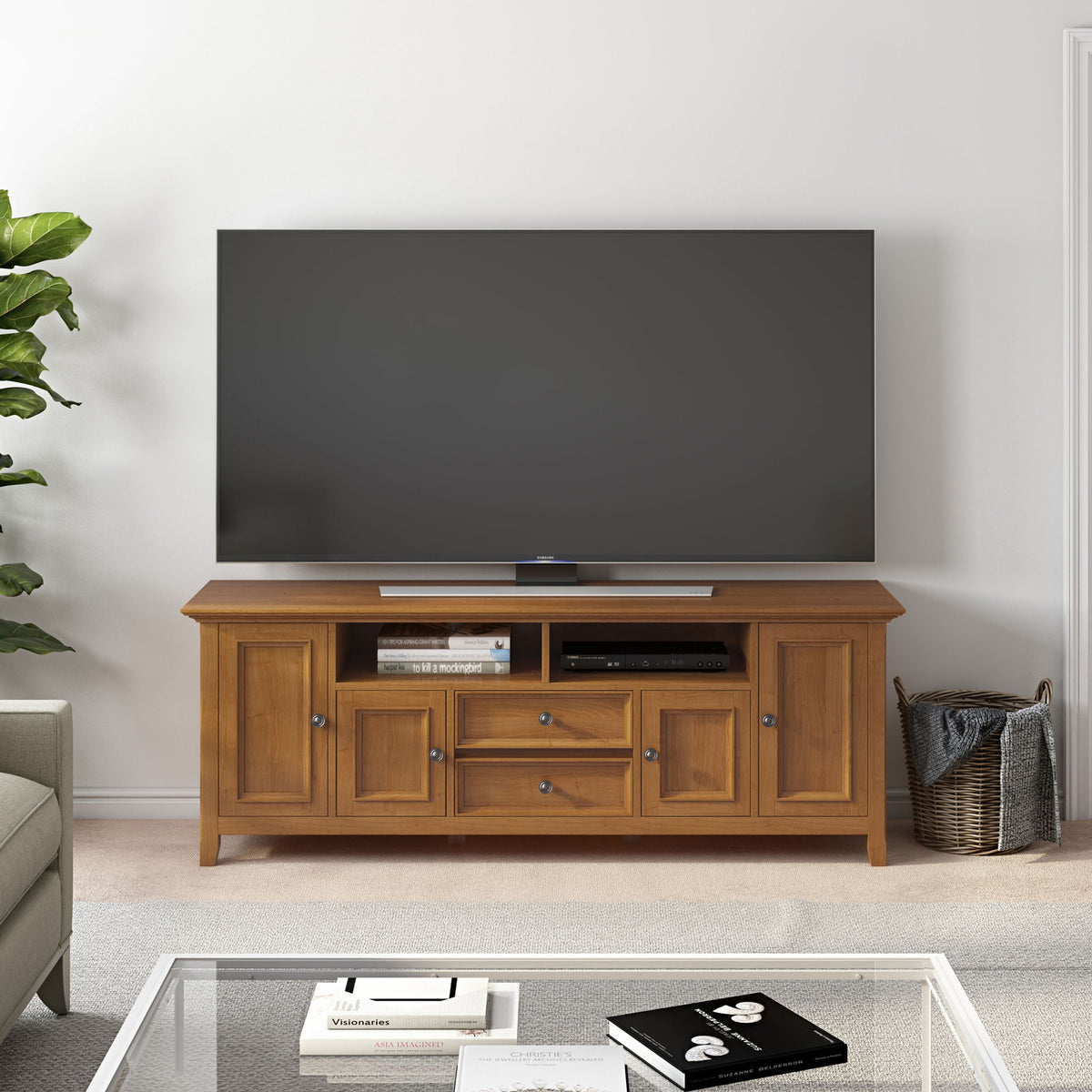 Handcrafted wide TV stand with ample storage in warm oak finish supporting a Samsung flat-screen TV on Tampa Home & Garden Store