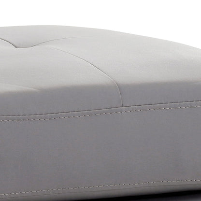 Upholstered ottoman in light gray faux leather with stitched detailing on Tampa Home & Garden Store