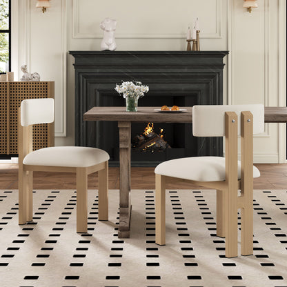 Modern upholstered armless dining chairs with light wood legs in a dining room on Tampa Home & Garden Store