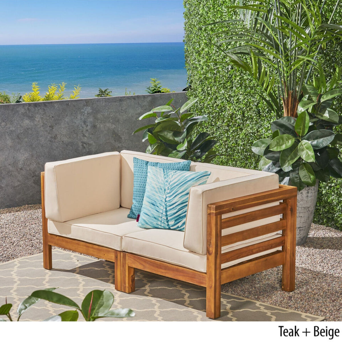 Oana 2-Piece Loveseat Set in teak with beige cushions and blue pillows HouseOfZazla on Tampa Home & Garden Store