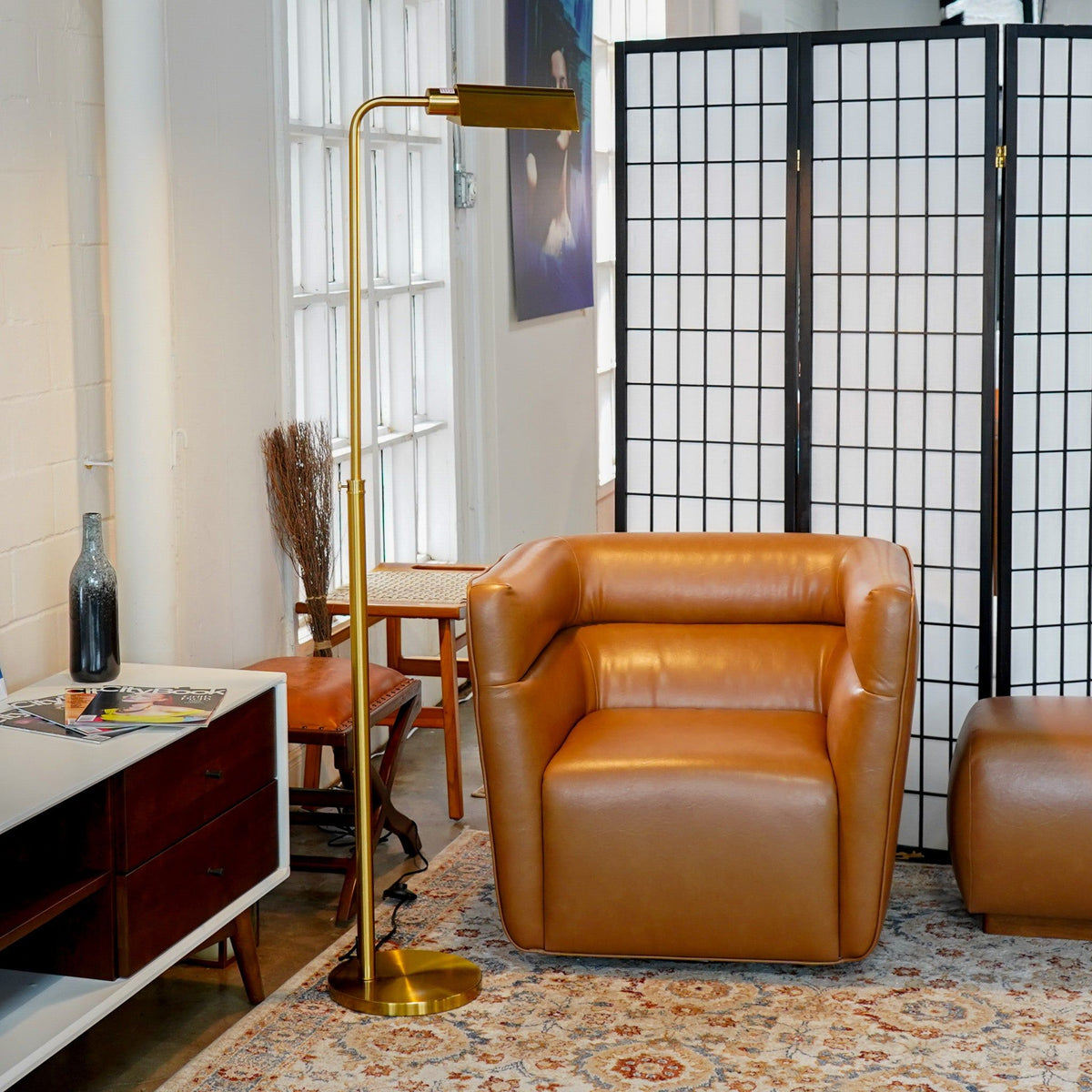Elara floor lamp in gold with slender curved stem and rectangular shade on Tampa Home & Garden Store
