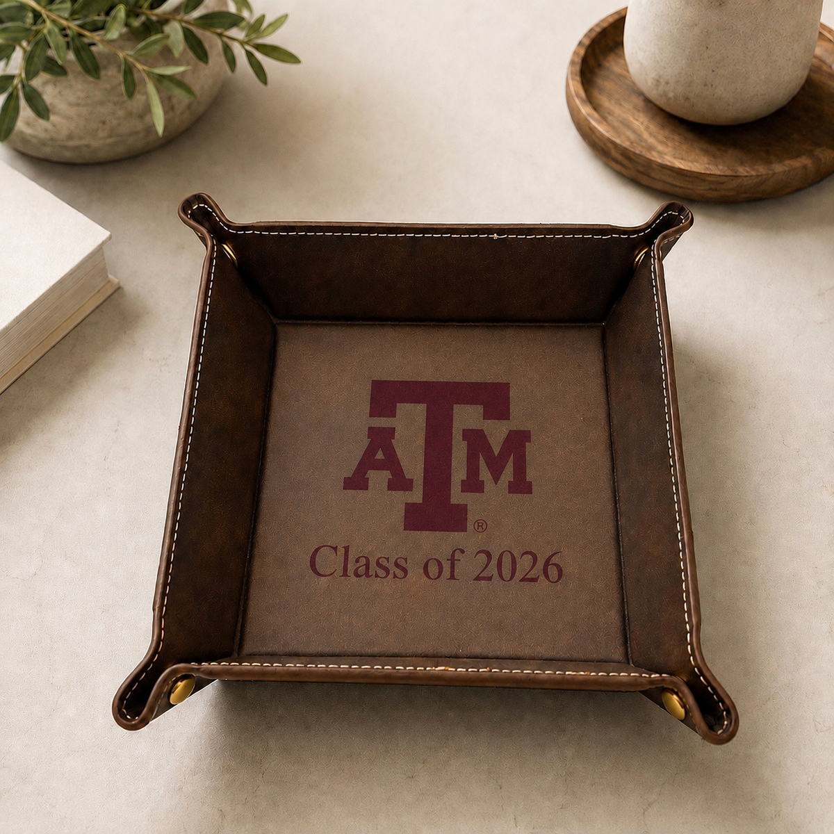 Brown leather catchall tray with maroon Texas A&M logo and Class of 2026 text inside on Tampa Home & Garden Store