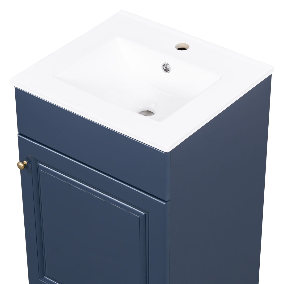 Bathroom vanity with sink, navy blue cabinet, white countertop, brass knobs on Tampa Home & Garden Store