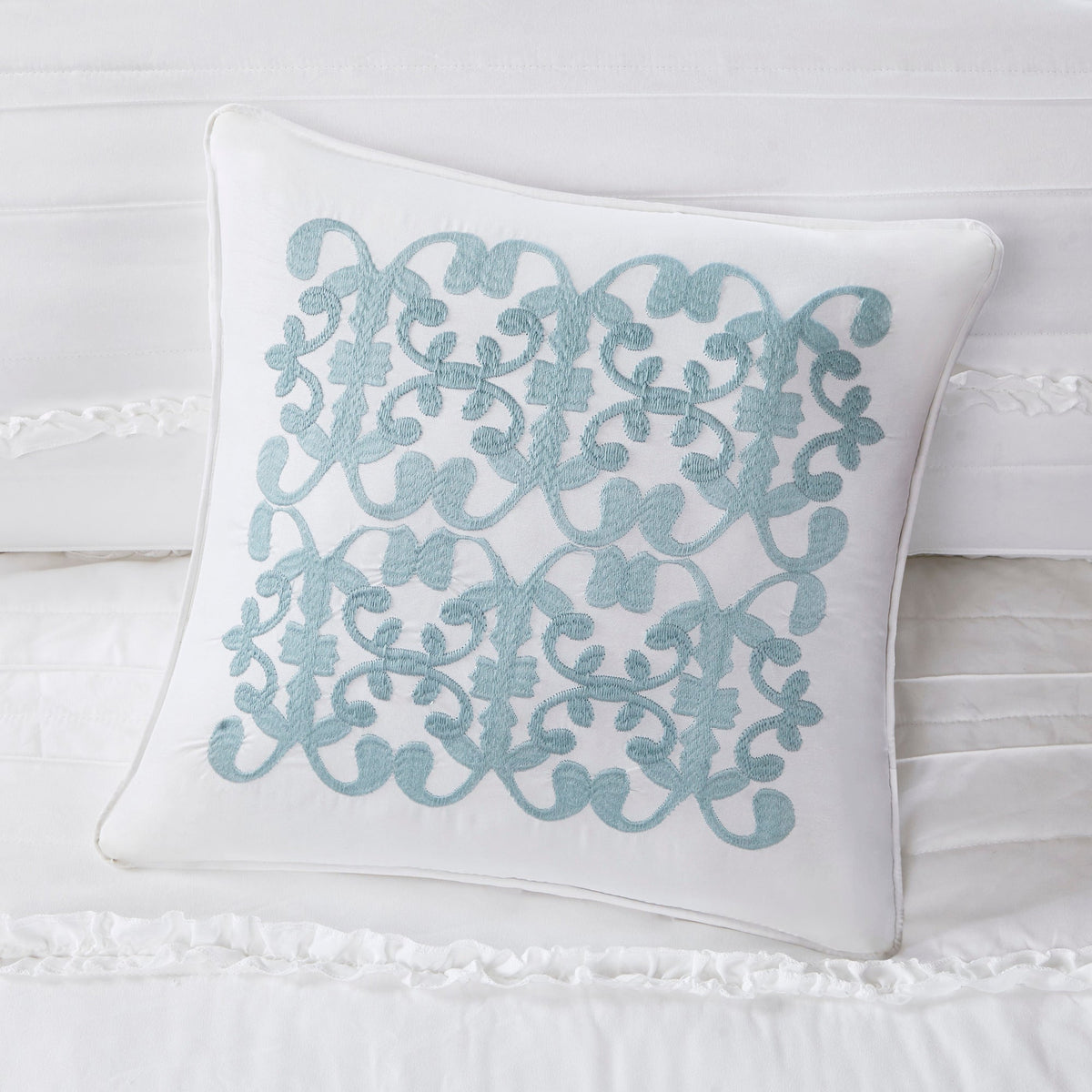 White reversible quilt set with embroidered blue scroll pattern throw pillow on Tampa Home & Garden Store