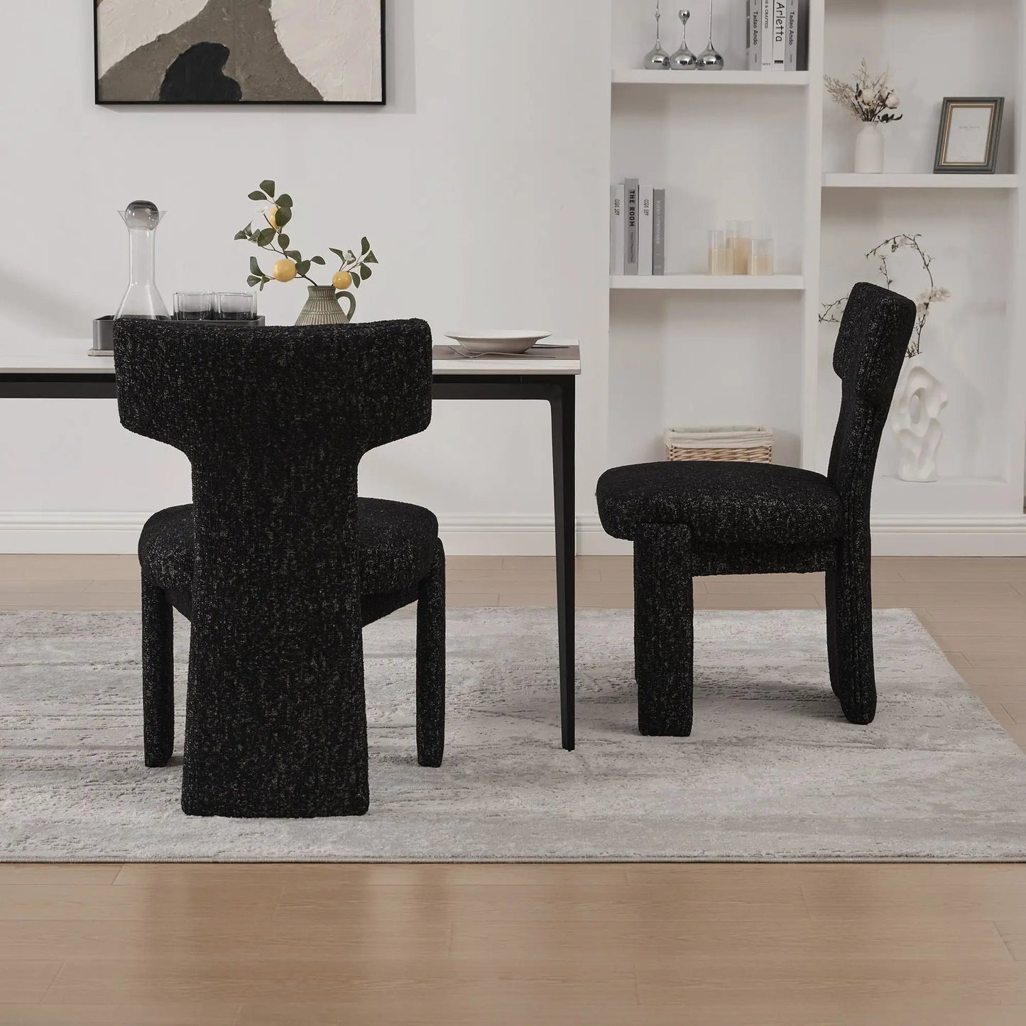 Armless Curved Back Accent Chairs in black textured fabric, 2pc around a white dining table on Tampa Home & Garden Store