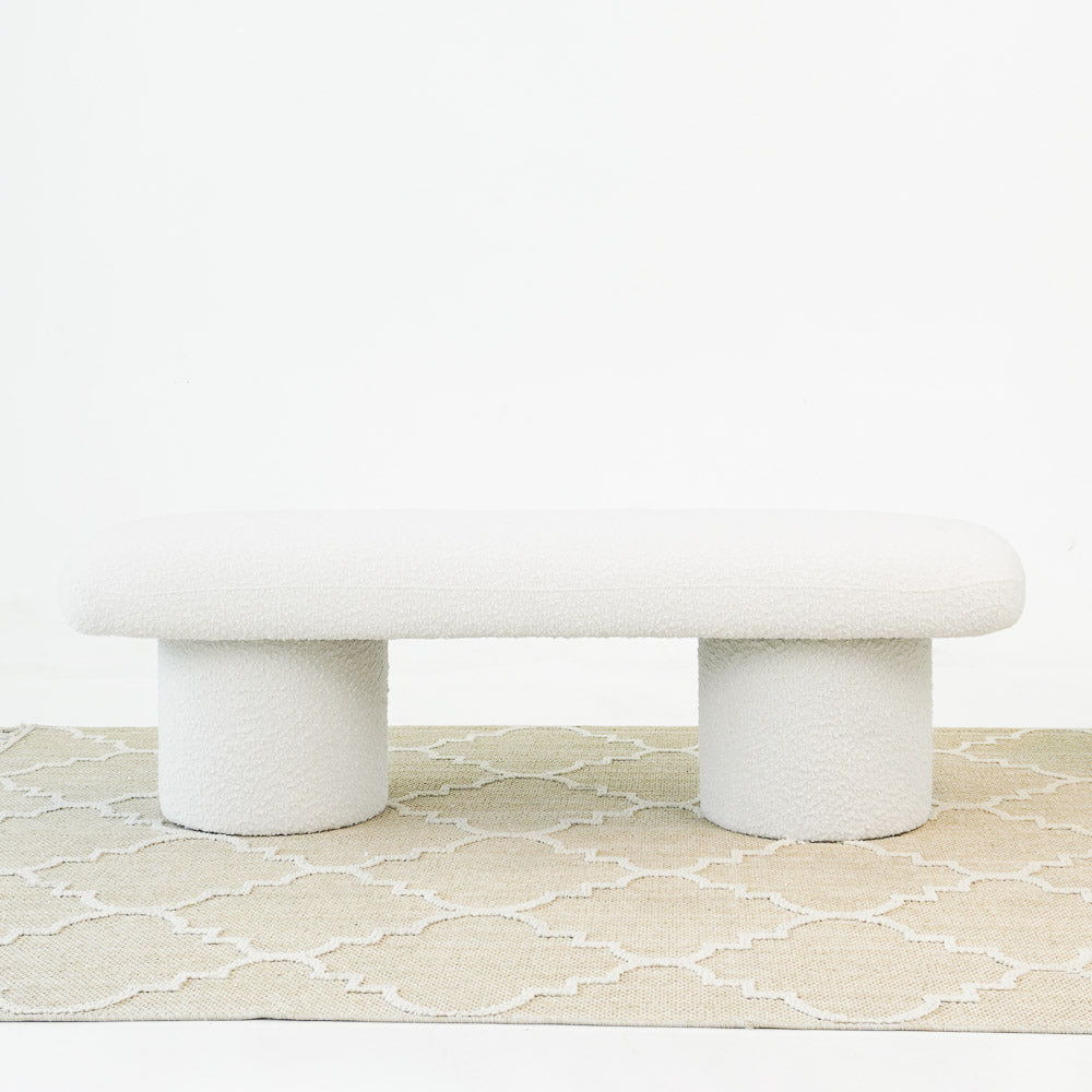 Ivory boucle fabric upholstered bench on two pedestal bases on Tampa Home & Garden Store