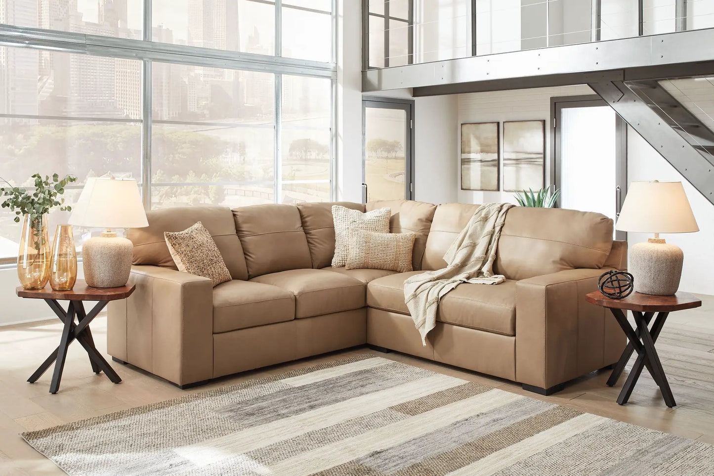 Bandon Sectional by Unique Piece Furniture in tan leather with neutral pillows on Tampa Home & Garden Store