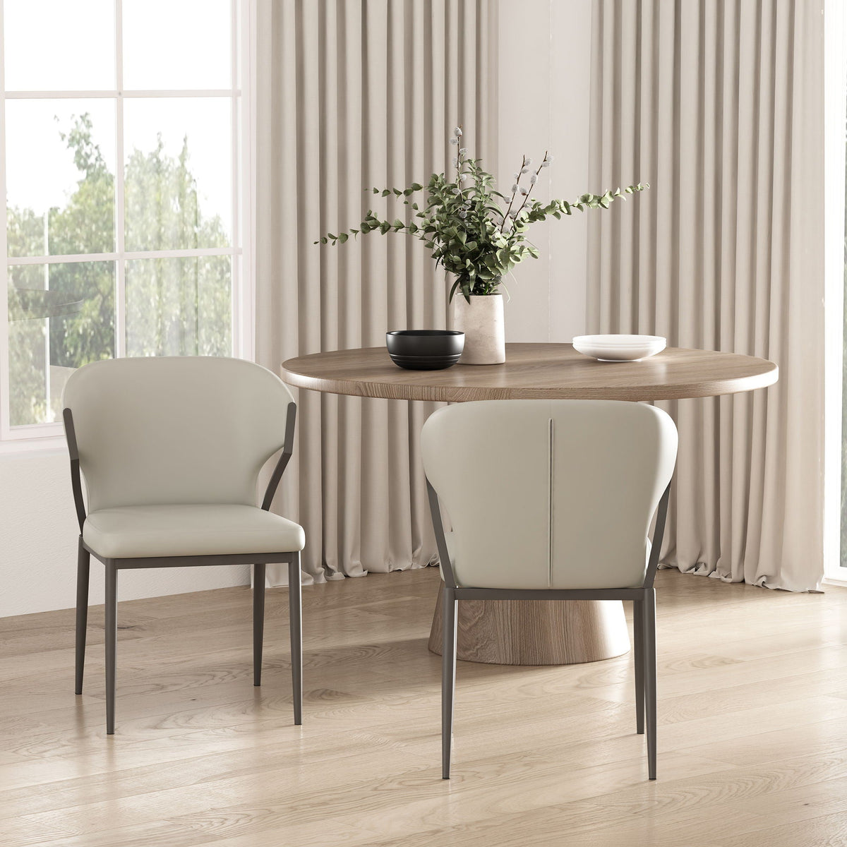 Kirsten Dining Chair Set of 2, white upholstered chairs with gray metal legs beside a round table on Tampa Home & Garden Store