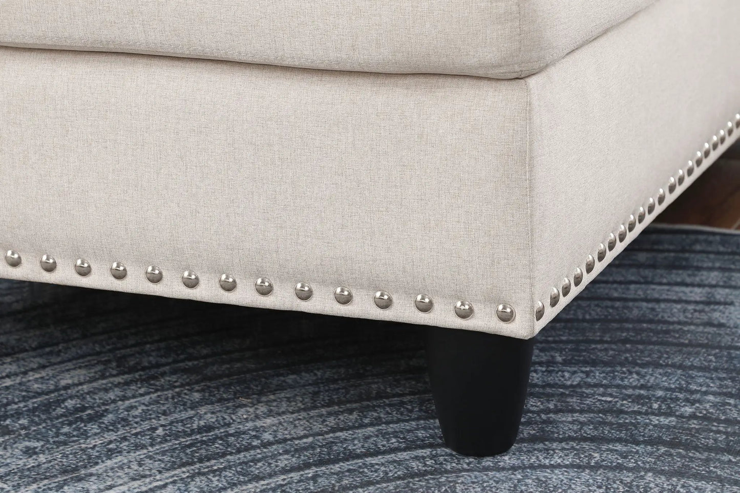 Alger wide left-hand facing beige sofa in linen fabric with silver nailhead trim on dark leg on Tampa Home & Garden Store