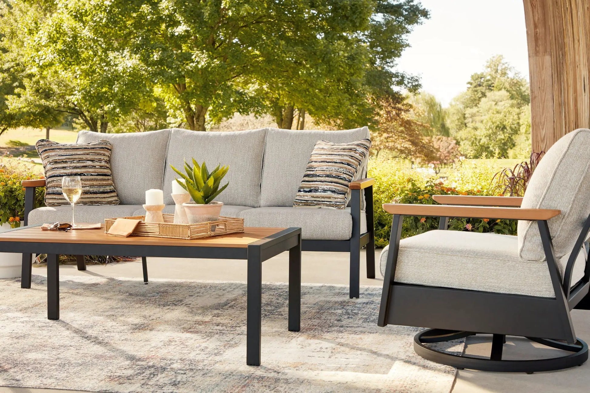 Carmel Highlands 4-piece outdoor sofa chairs table set in dark brown with beige cushions on Tampa Home & Garden Store