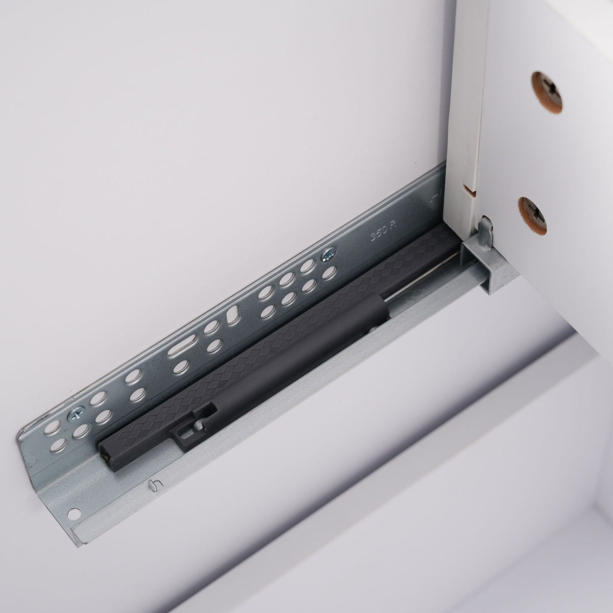 Vanity drawer slide with perforated metal track and white cabinet panel on Tampa Home & Garden Store