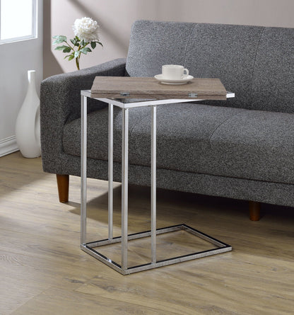 Danson Weathered Oak Accent Table with chrome metal base beside a gray sofa on Tampa Home & Garden Store