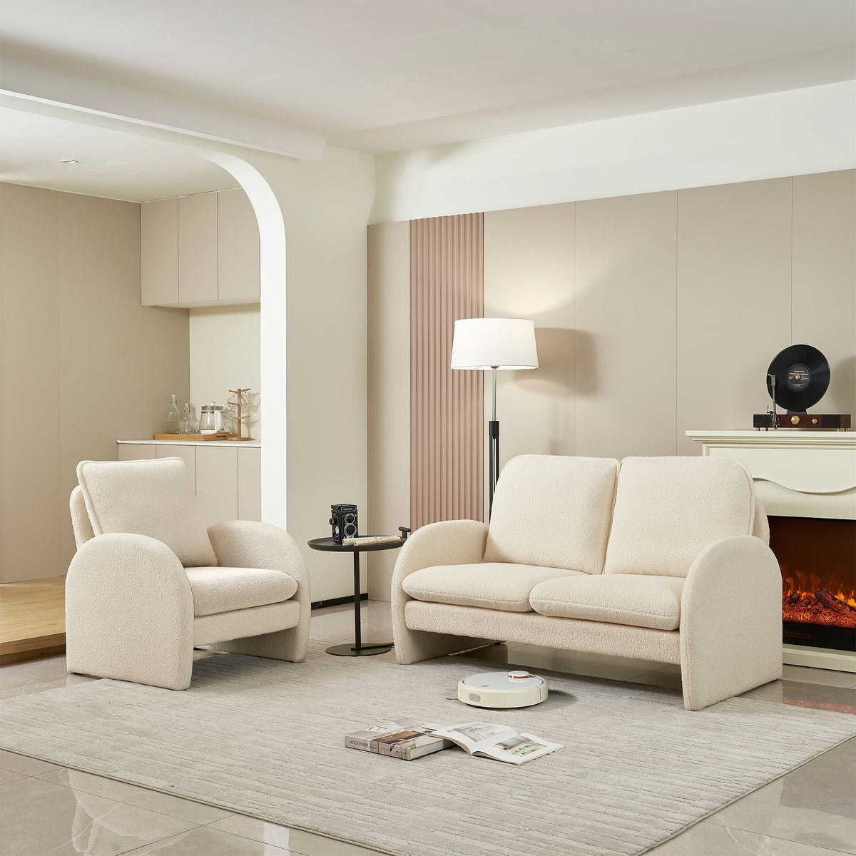 Set of four cream sherpa loveseats in a modern living room with a round side table on Tampa Home & Garden Store