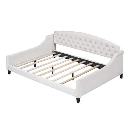Modern tufted button daybed in white upholstery with curved headboard and wooden slat frame on Tampa Home & Garden Store