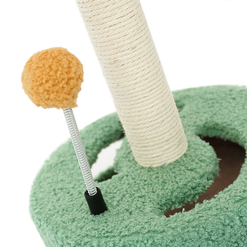 Cat scratch board with green plush ring, sisal post, and orange pom-pom spring toy on Tampa Home & Garden Store