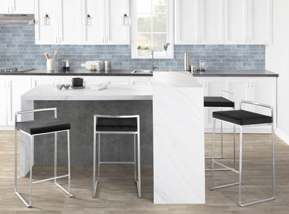 Stackable barstools with padded black seats and chrome frames around a marble island four stools on Tampa Home & Garden Store