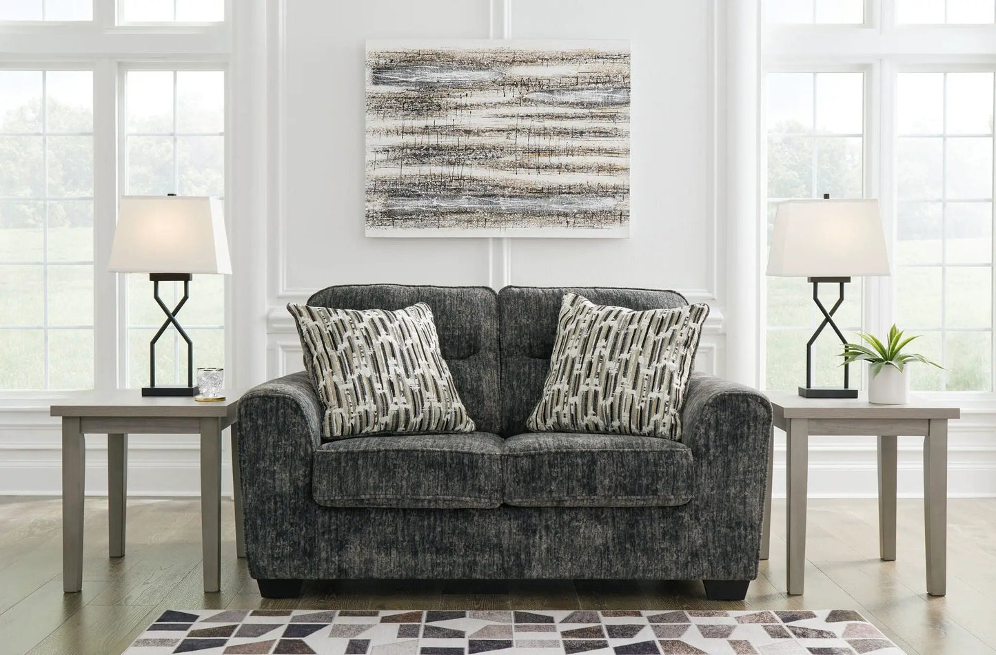 Lonoke living room set stationary sofa in dark gray fabric with 2 patterned cushions and lamps on Tampa Home & Garden Store