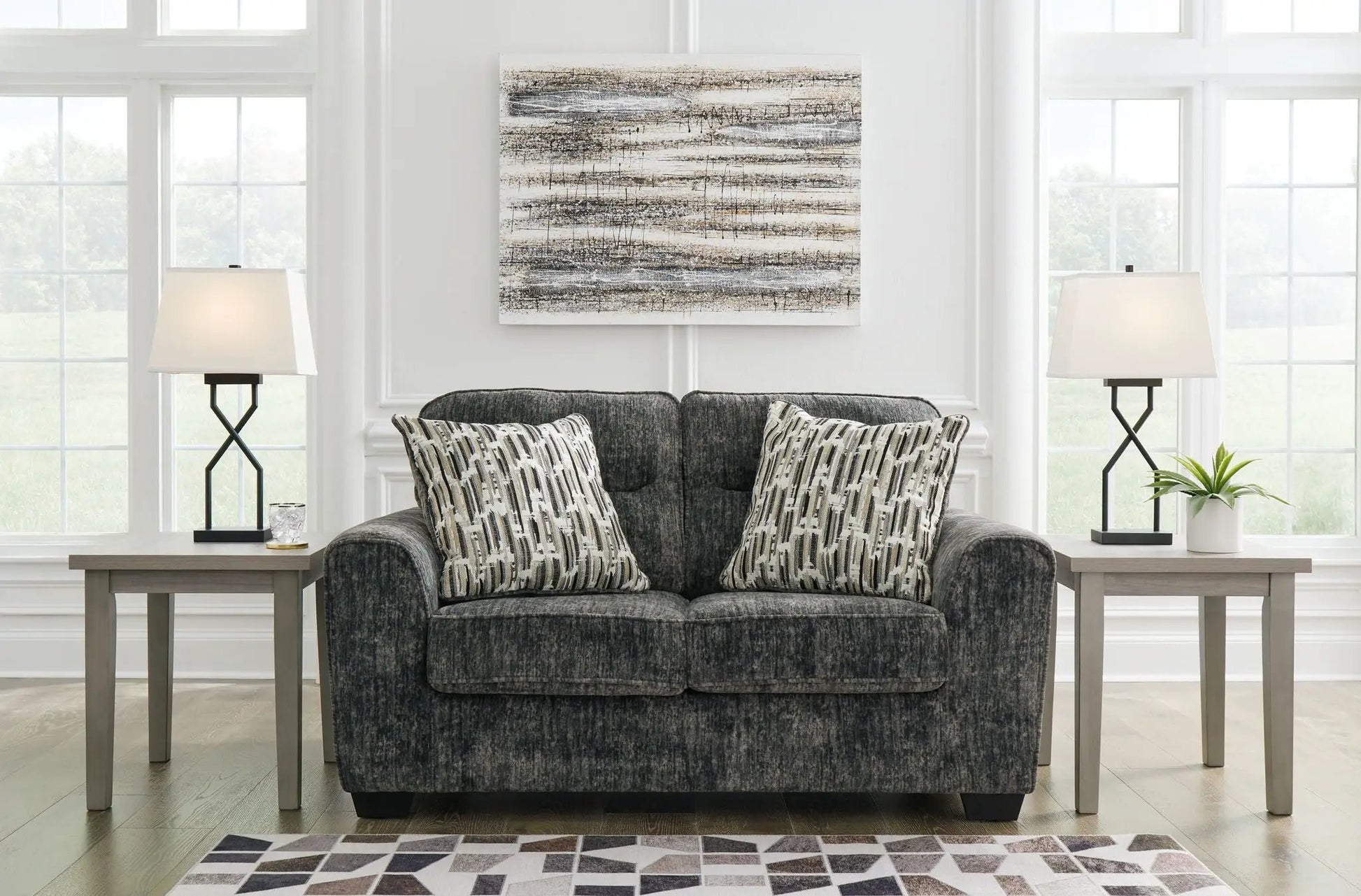 Lonoke living room set stationary sofa in dark gray fabric with 2 patterned cushions and lamps on Tampa Home & Garden Store