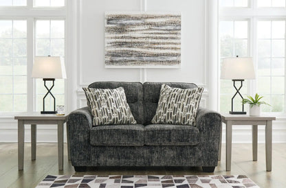 Lonoke living room set stationary sofa in dark gray fabric with 2 patterned cushions and lamps on Tampa Home & Garden Store