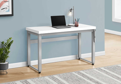 Adjustable standing computer desk white top with silver frame, laptop and lamp on blue wall on Tampa Home & Garden Store