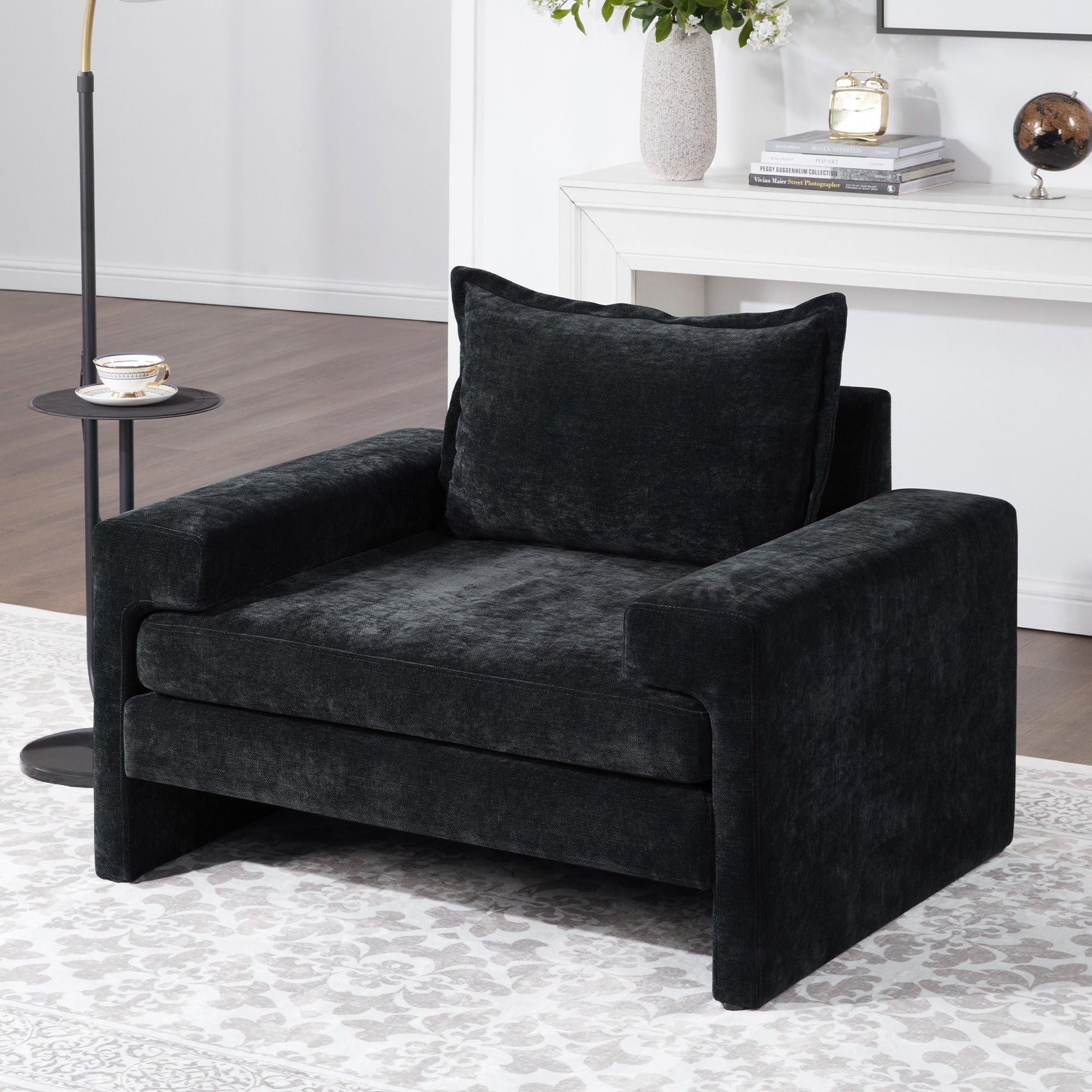 Upholstered accent armchair with wide arms and ergonomic back support in dark charcoal fabric on Tampa Home & Garden Store