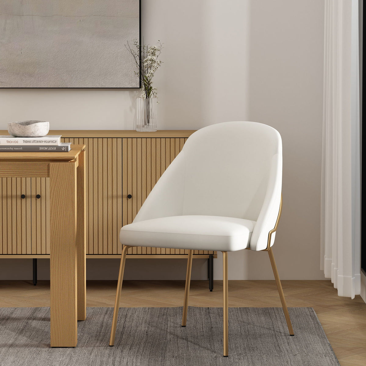 Pair of upholstered dining chairs with high-density foam in white, seats with gold legs on Tampa Home & Garden Store