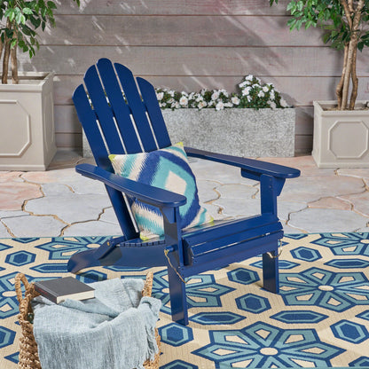 Blue Hollywood Adirondack chair with tropical pillow on a backyard patio on Tampa Home & Garden Store