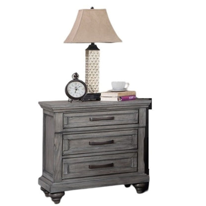 3 Piece Bedroom Set nightstand display in gray wood with lamp, clock, and books on Tampa Home & Garden Store