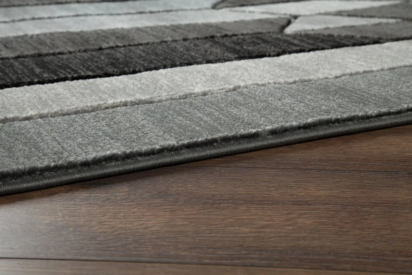 Chayse rug by Unique Piece Furniture, gray striped plush pile area rug on wood floor on Tampa Home & Garden Store