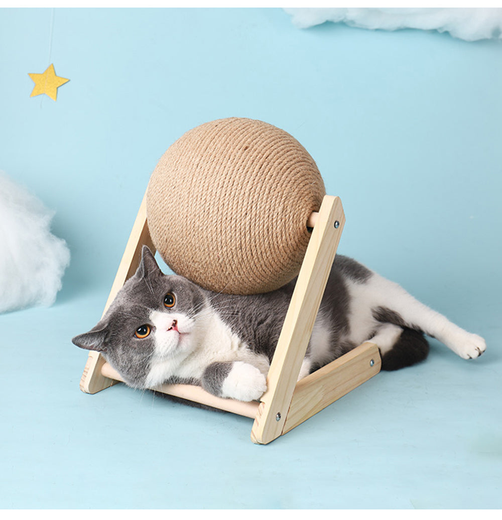 Professional Vertical Cat Toy Sisal Ball on a wooden stand with a gray and white cat lounging beside it on Tampa Home & Garden Store