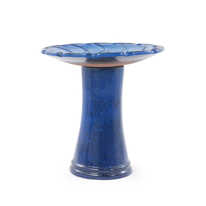 Handmade glazed ceramic bird bath in sapphire blue with leaf-pattern rim on a tall pedestal base on Tampa Home & Garden Store
