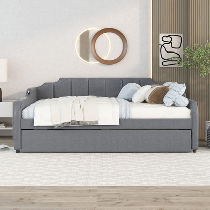 Full-size gray upholstered daybed with trundle and USB charging, layered white and gray bedding on Tampa Home & Garden Store