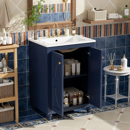 Bathroom vanity with ornate elliptical motif navy cabinet, white sink, brass fixtures on Tampa Home & Garden Store