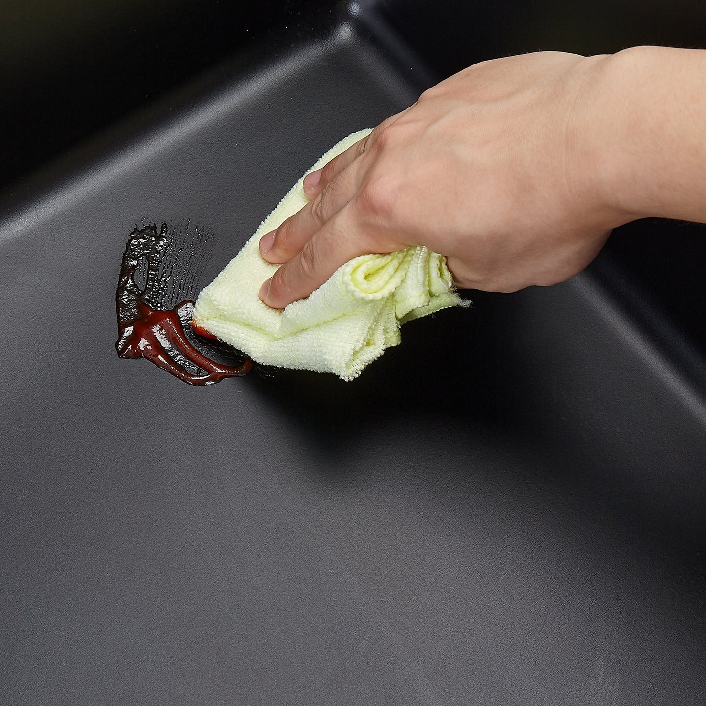 HouseOfZazla 25 Inch granite kitchen sink top mount single bowl being wiped clean by hand on Tampa Home & Garden Store