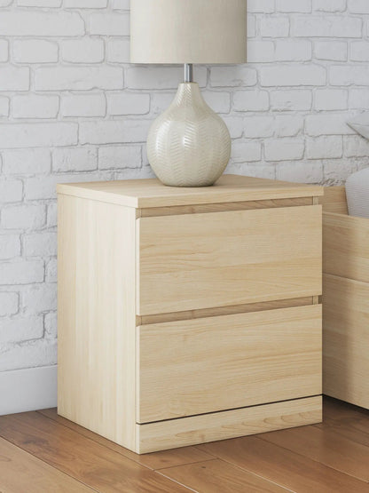 Onita two-drawer night stand in natural light wood with a beige ceramic lamp on top on Tampa Home & Garden Store