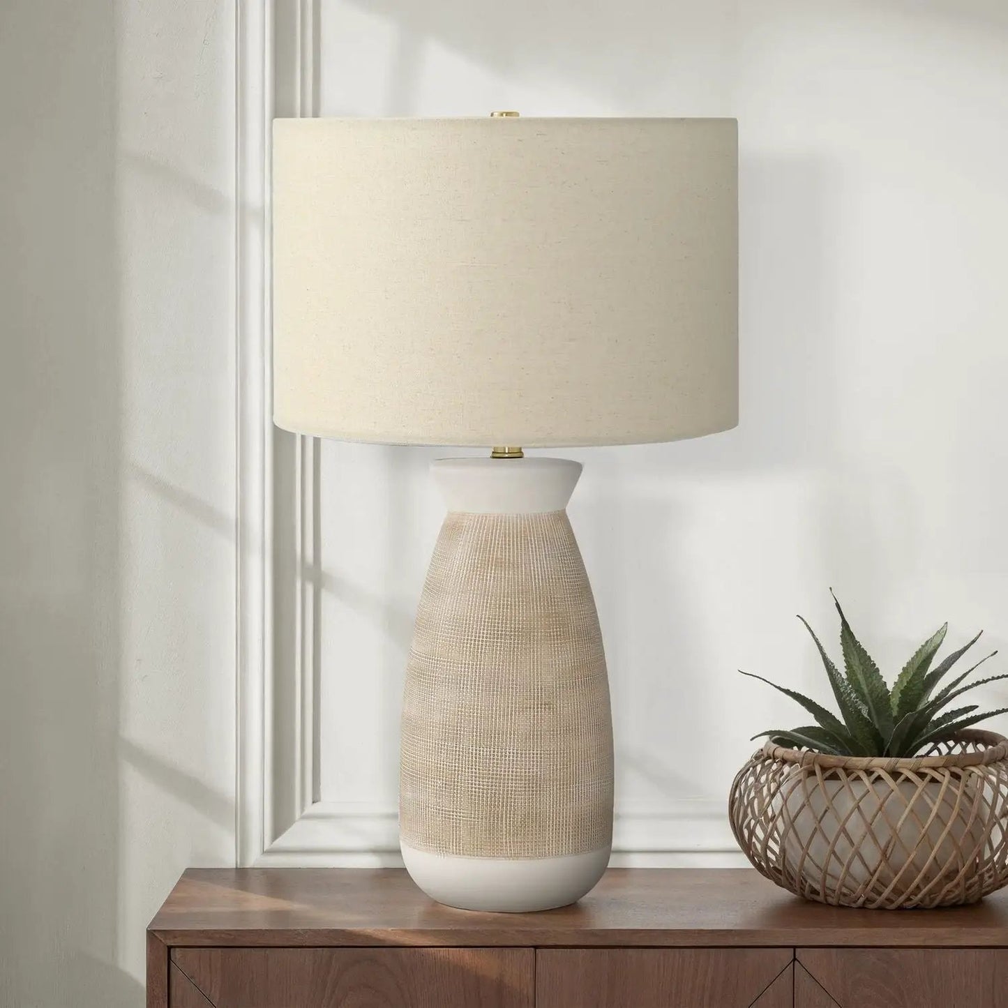 Table lamp cream ceramic resin base with beige textured finish and cream linen shade on Tampa Home & Garden Store