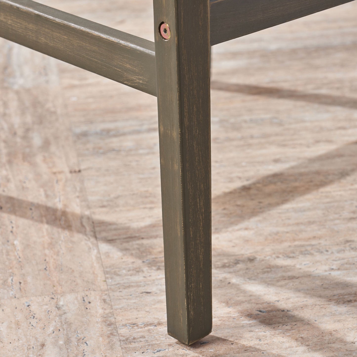 Stamford Barstool leg in distressed brown wood with cross brace and visible screw on Tampa Home & Garden Store