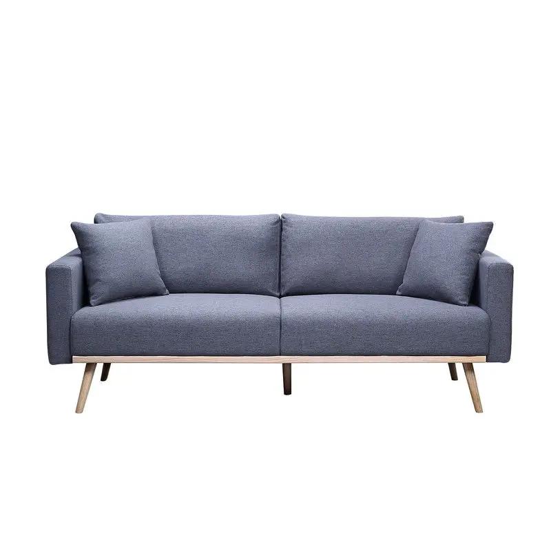 Easton fabric stationary sofa in blue-gray with wooden legs and two throw pillows on Tampa Home & Garden Store