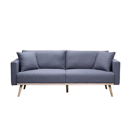 Easton fabric stationary sofa in blue-gray with wooden legs and two throw pillows on Tampa Home & Garden Store