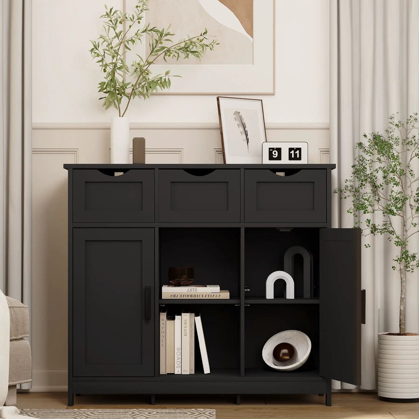 Sideboard storage cabinet with drawers and shelves in a dark matte black finish top vase and framed art on Tampa Home & Garden Store