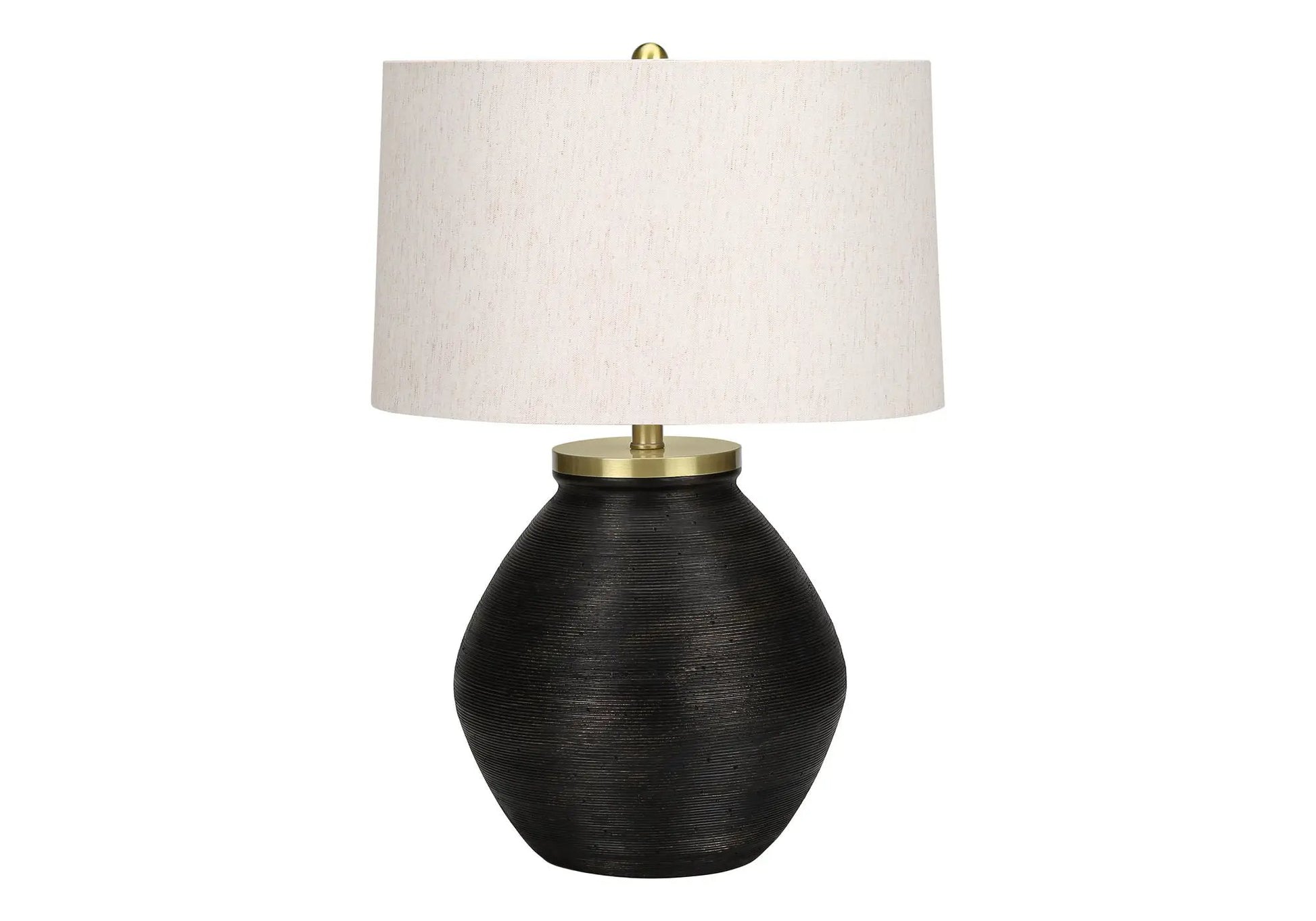 Table lamp with cream fabric shade and black ribbed ceramic base, brass hardware on Tampa Home & Garden Store