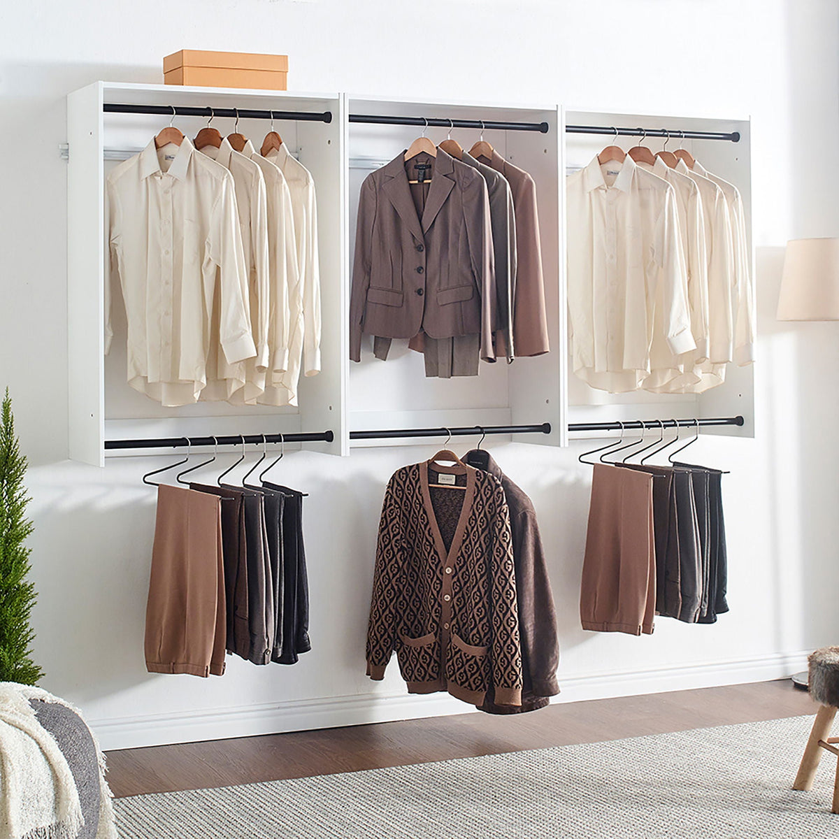 Wall mounted wood closet system with three white modular wardrobes by HouseOfZazla, black rods on Tampa Home & Garden Store