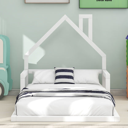 White platform floor bed with a house-shaped headboard, bedding and navy striped pillow on Tampa Home & Garden Store