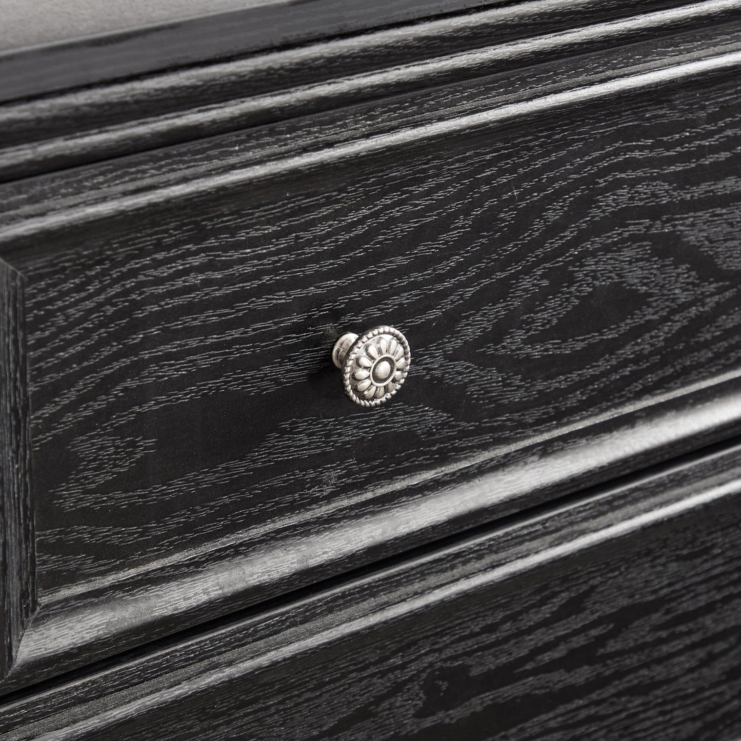 Modern 5-drawer black dresser with textured wood grain and silver rosette knobs on Tampa Home & Garden Store